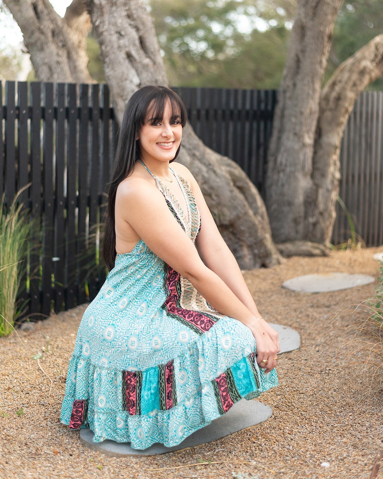 Apollo Bay Mini Dress in vibrant turquoise and pink with open-back design and adjustable halter neck