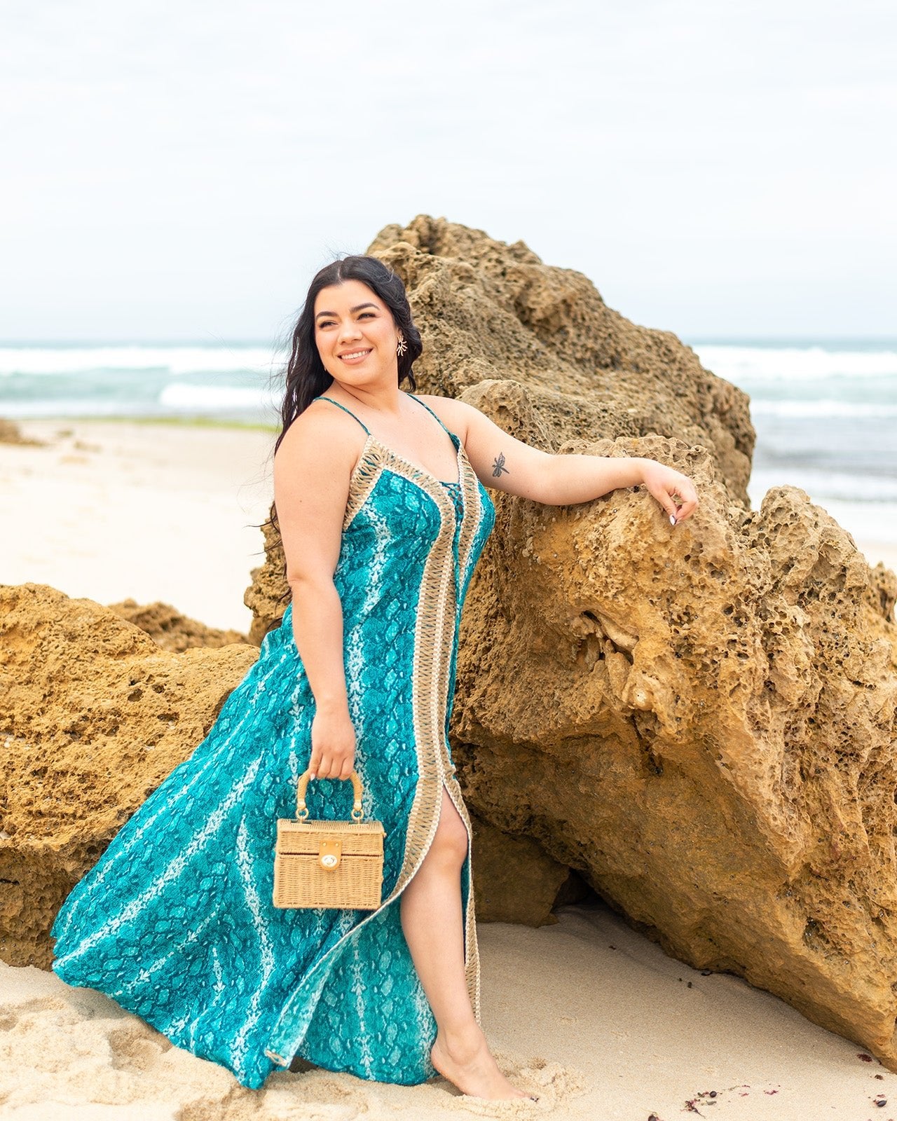 Banksia Maxi Dress featuring striking snake print in deep blues with deep V-neckline