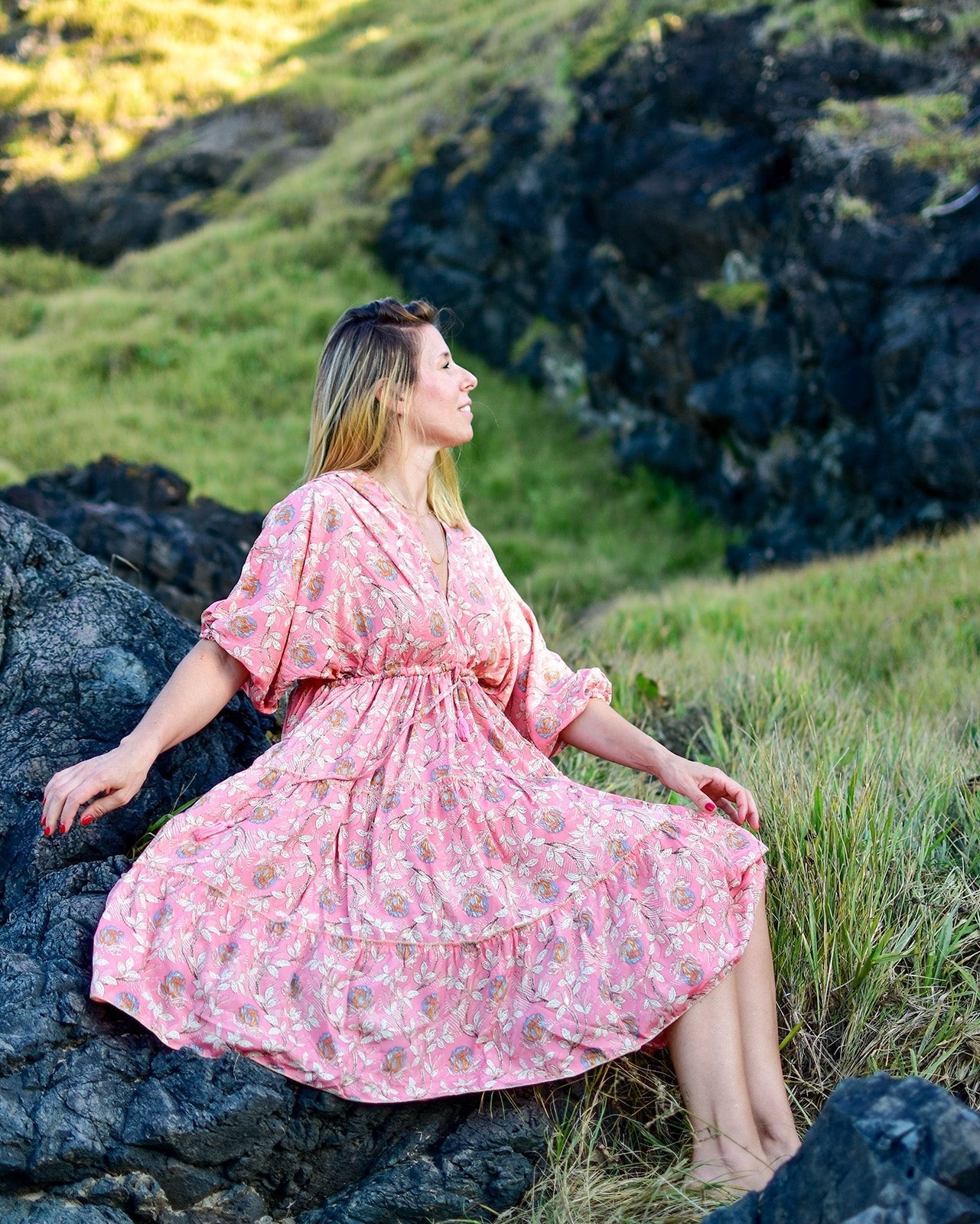 Kora Midi Dress featuring a floral print in blush pink and gold with a relaxed V-neckline